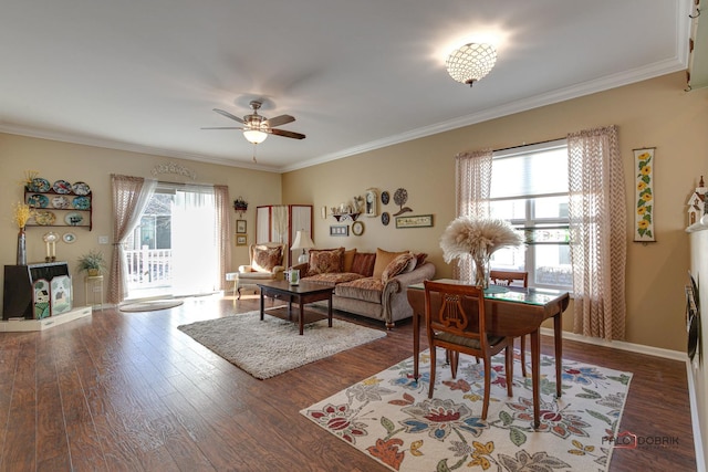 living room with dark hardwood / wood-style flooring and crown molding