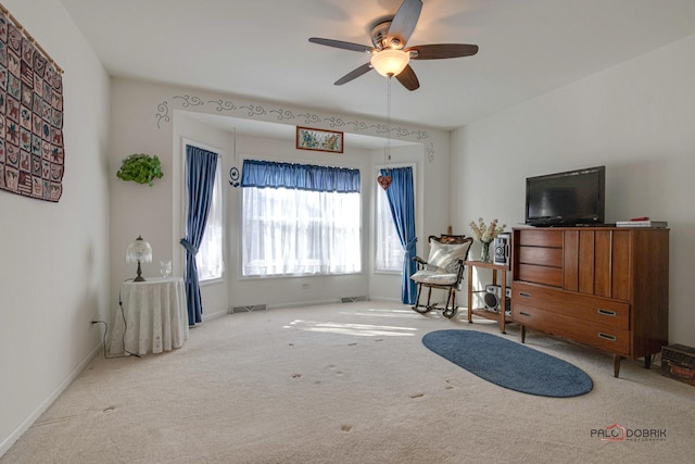 living room featuring ceiling fan and light carpet