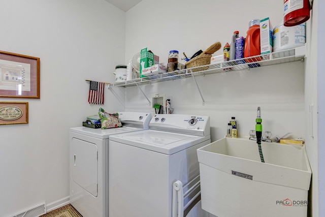 laundry area featuring sink and washing machine and clothes dryer