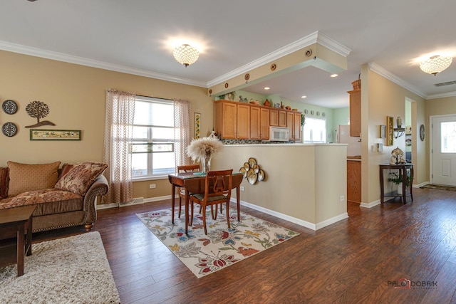 dining area with ornamental molding and dark wood-type flooring