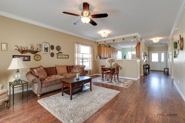 living room featuring ornamental molding, dark hardwood / wood-style flooring, and ceiling fan