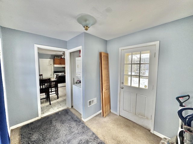 entryway featuring carpet flooring