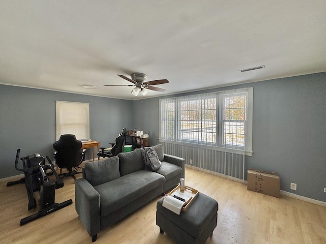 living room featuring ceiling fan and light hardwood / wood-style flooring