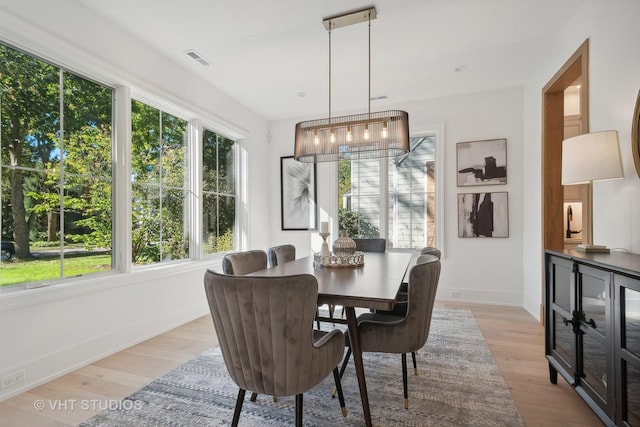 dining area with light hardwood / wood-style floors