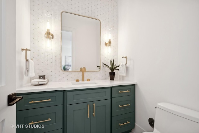 bathroom with vanity and toilet