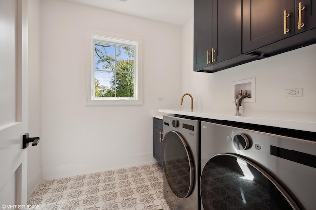 laundry room with washer and dryer, light tile patterned flooring, and cabinets