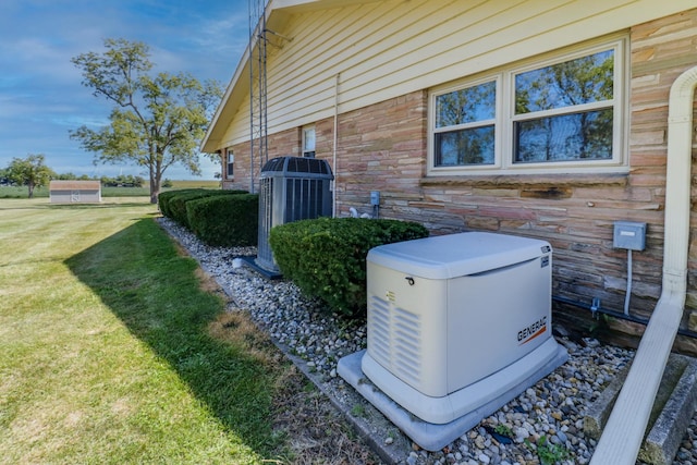 view of home's exterior featuring a yard and central air condition unit