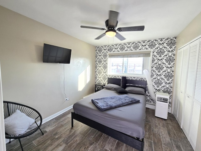 bedroom with ceiling fan and a closet