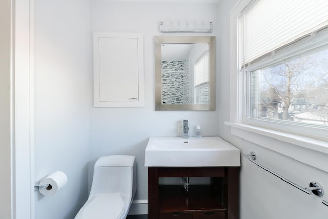 bathroom with vanity and toilet