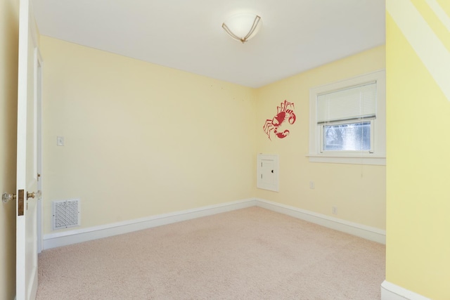 empty room featuring light carpet