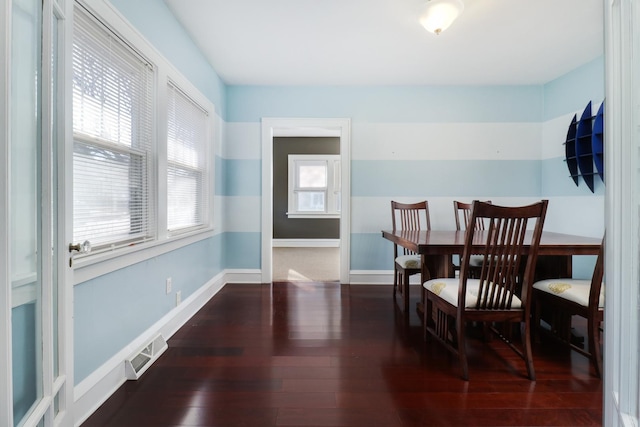 dining area featuring dark hardwood / wood-style flooring