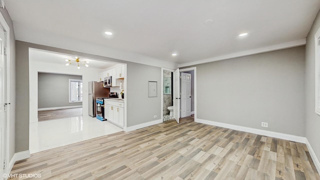 unfurnished living room featuring light wood-type flooring