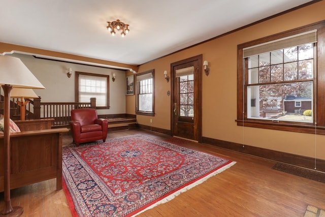 interior space with crown molding and hardwood / wood-style floors