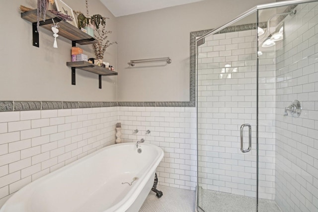 bathroom featuring tile patterned flooring, shower with separate bathtub, and tile walls