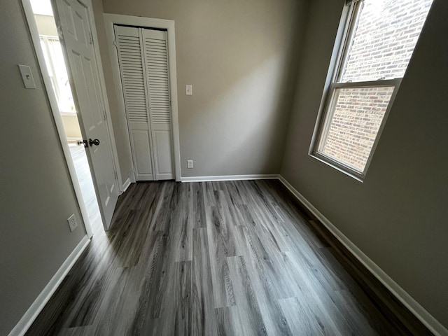 interior space featuring dark hardwood / wood-style flooring and a healthy amount of sunlight