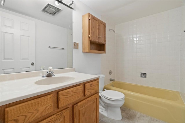 full bathroom with tile patterned flooring, vanity, toilet, and shower / tub combination