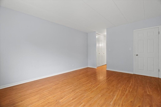 spare room with light hardwood / wood-style floors