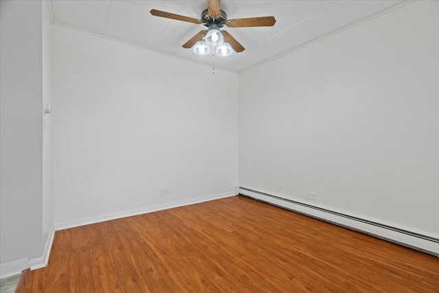 empty room featuring ceiling fan, wood-type flooring, and baseboard heating