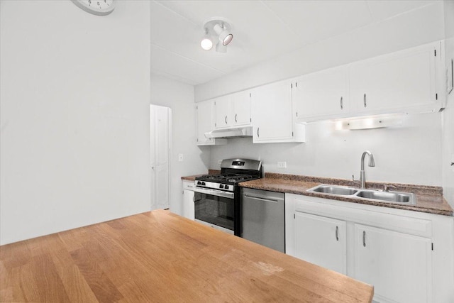 kitchen with light hardwood / wood-style floors, sink, white cabinetry, and stainless steel appliances