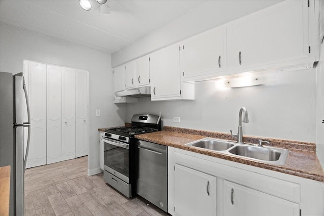 kitchen featuring sink, white cabinets, and appliances with stainless steel finishes