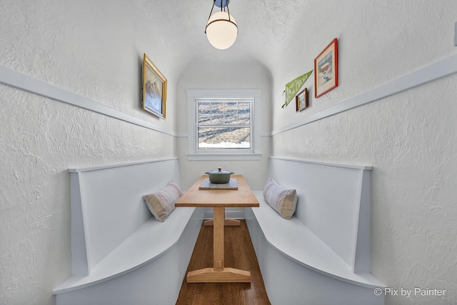 dining room with breakfast area and vaulted ceiling