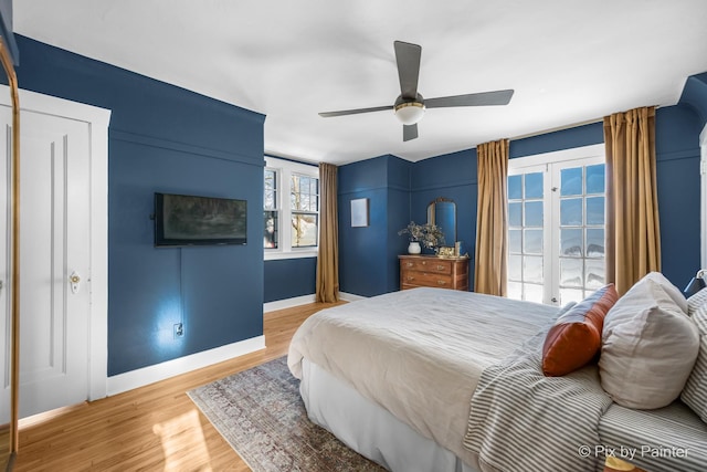 bedroom with ceiling fan and hardwood / wood-style floors