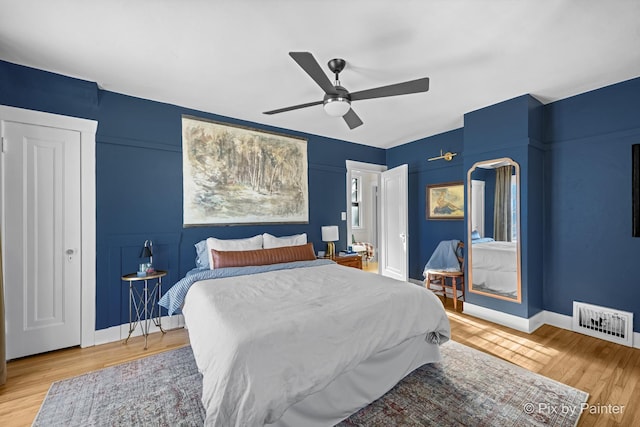 bedroom featuring ceiling fan and hardwood / wood-style flooring