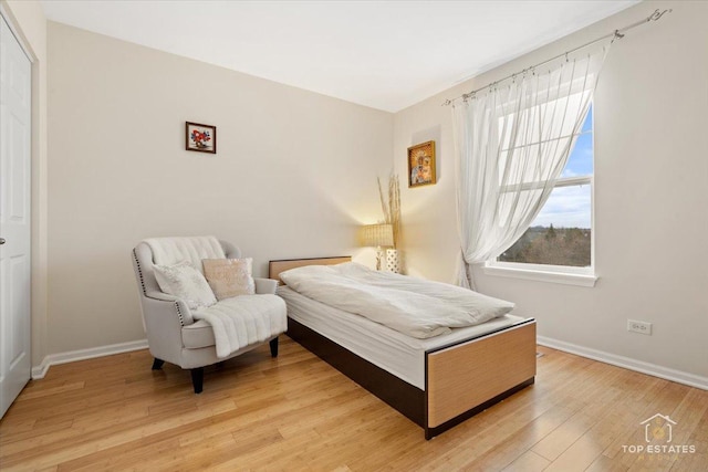 bedroom with hardwood / wood-style floors