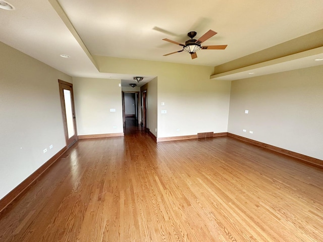 spare room featuring ceiling fan and hardwood / wood-style floors