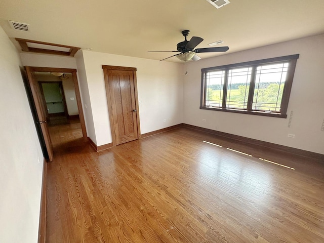 unfurnished bedroom with hardwood / wood-style floors and ceiling fan