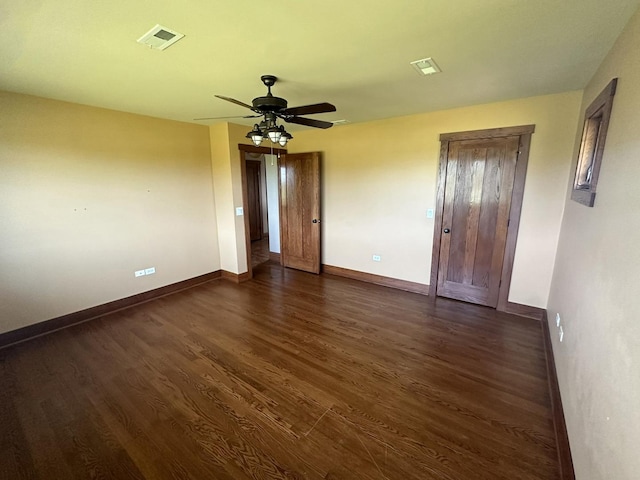 unfurnished bedroom featuring ceiling fan and dark hardwood / wood-style floors