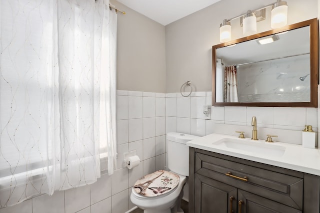 bathroom featuring vanity, toilet, tile walls, and a shower with curtain