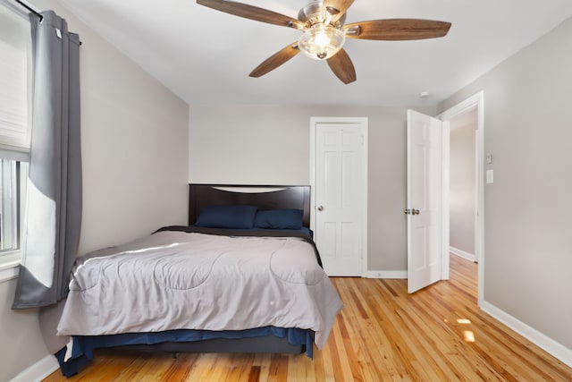 bedroom featuring ceiling fan and light hardwood / wood-style floors