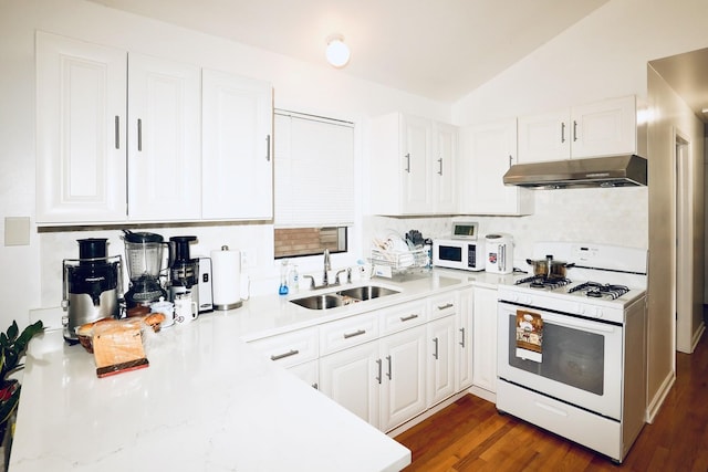 kitchen featuring lofted ceiling, dark hardwood / wood-style floors, sink, white appliances, and white cabinetry