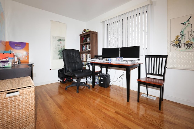 bedroom with hardwood / wood-style flooring