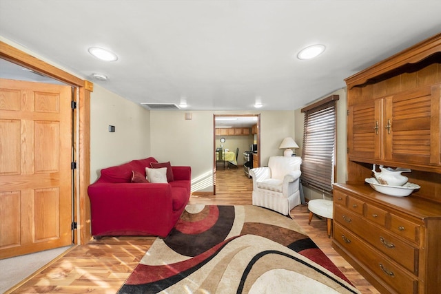 living room with light hardwood / wood-style flooring