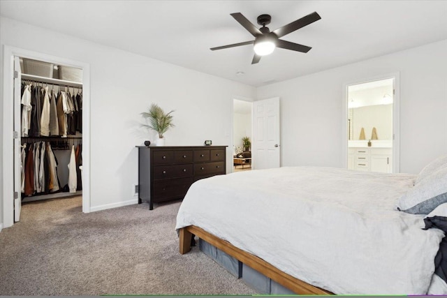 bedroom with light carpet, a closet, ensuite bath, and ceiling fan