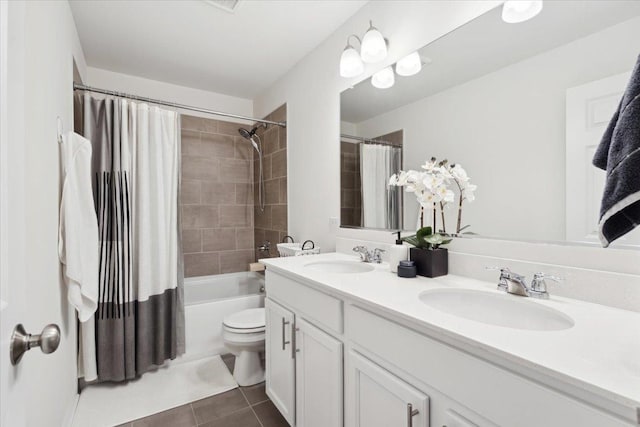 full bathroom featuring toilet, shower / tub combo, vanity, and tile patterned floors