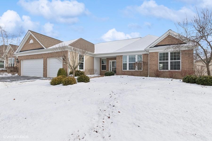 3717 Canton Cir, Mundelein, IL 60060 - ranch-style house with brick siding and an attached garage