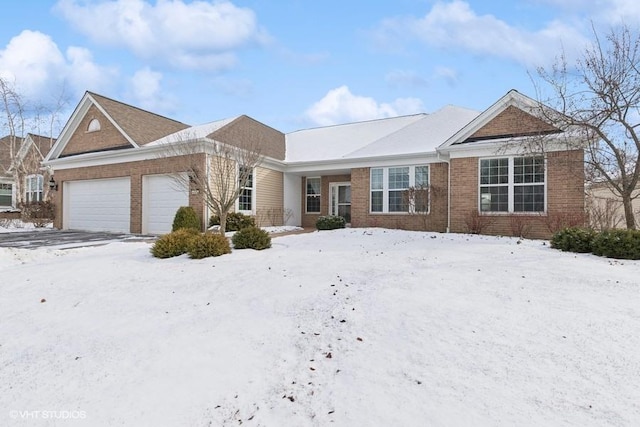 ranch-style house with brick siding and an attached garage