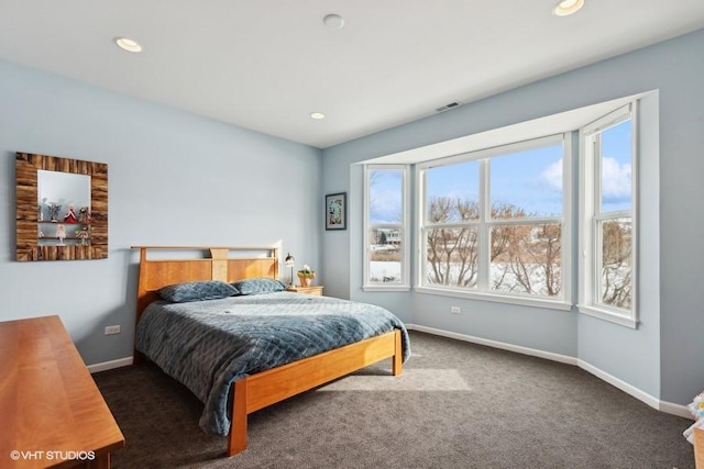 carpeted bedroom featuring recessed lighting, visible vents, and baseboards