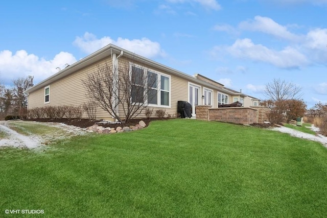 view of home's exterior featuring a lawn