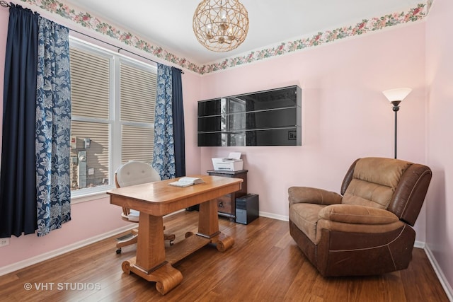 office area with a chandelier and hardwood / wood-style floors