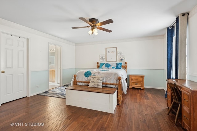 bedroom with ceiling fan, ensuite bathroom, and dark hardwood / wood-style floors