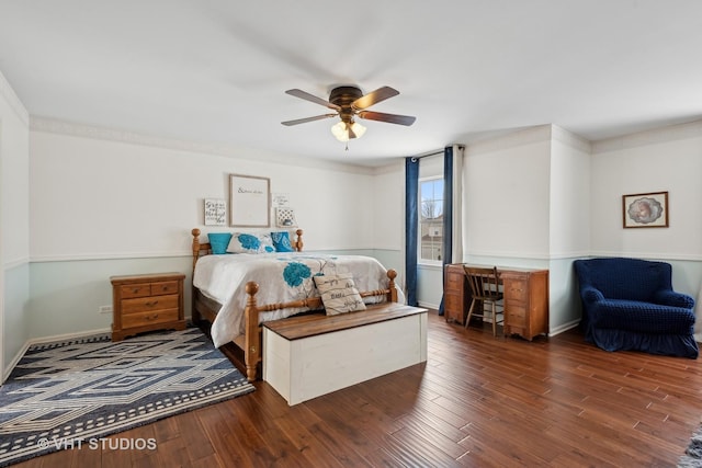 bedroom with ceiling fan, dark hardwood / wood-style flooring, and ornamental molding