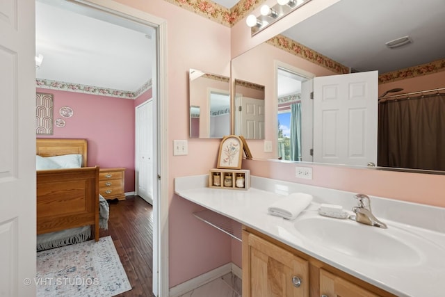 bathroom featuring vanity and wood-type flooring