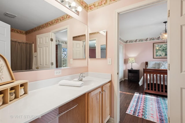 bathroom featuring hardwood / wood-style floors and vanity