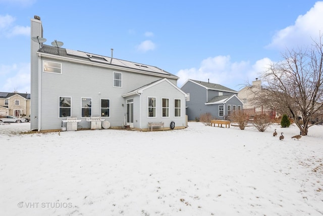 view of snow covered house