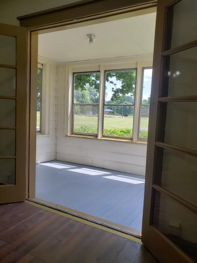 entryway with dark hardwood / wood-style flooring