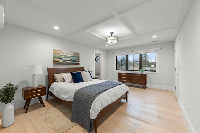 bedroom featuring coffered ceiling and light hardwood / wood-style flooring